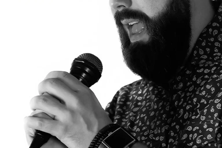 How do I develop my vocal range while singing Hindustani music