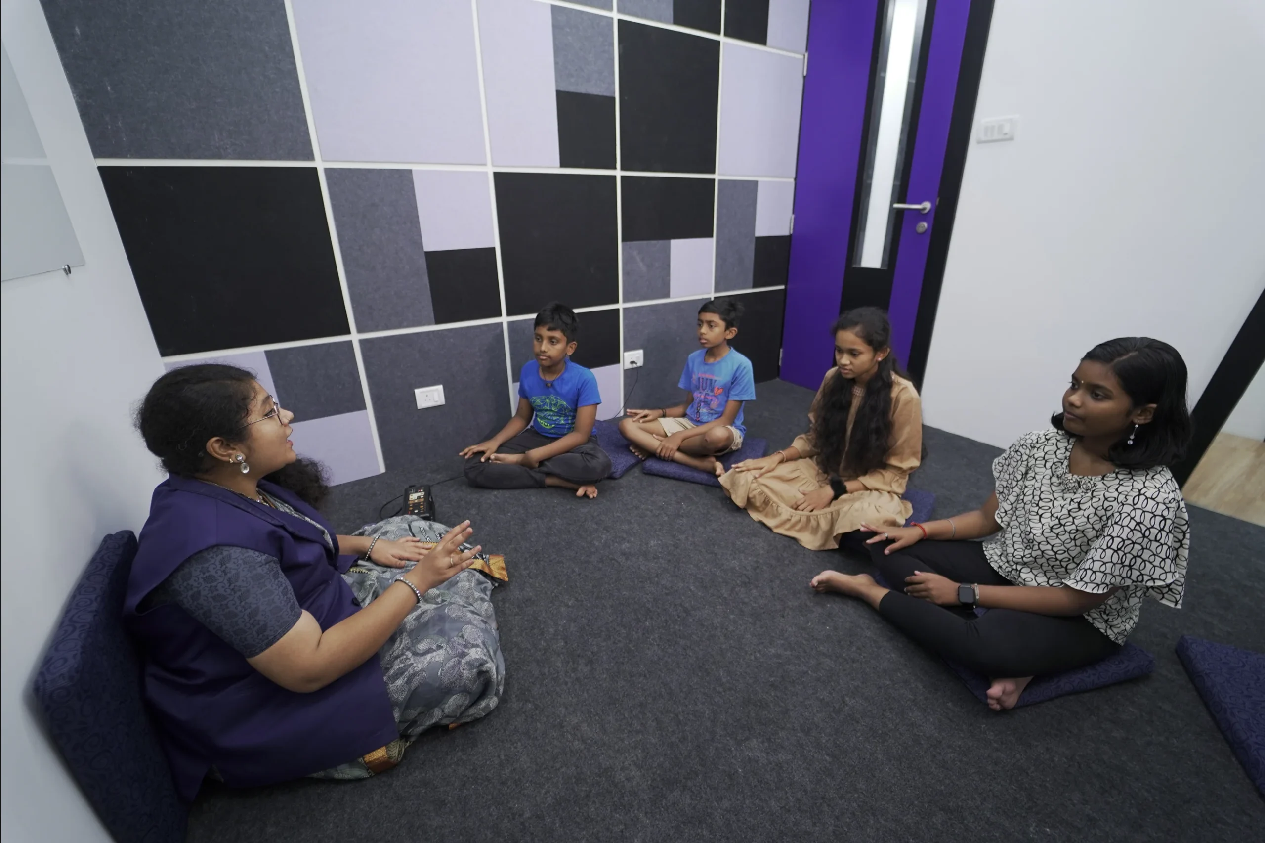Students learning music in Indian Music Class